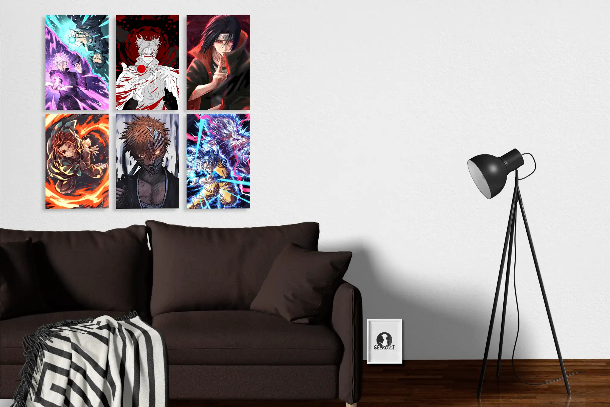 Living room with six Geekozi anime posters on the wall, a chocolate-colored sofa, a black lamp, a Geekozi logo frame, and a blanket draped over the sofa.